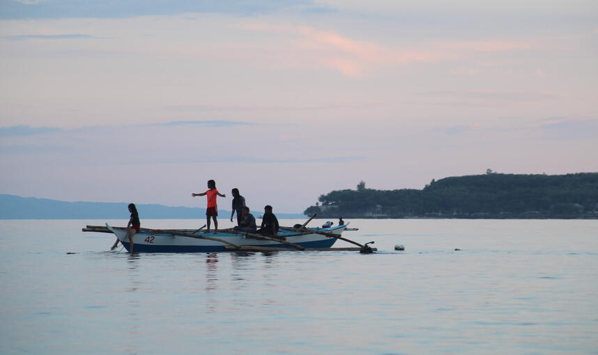 Children playing in boats